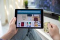 Man holding iPad Pro with Online shopping service Amazon