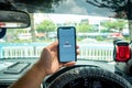 A man holding the iPhone X with Waze navigation app inside the car Royalty Free Stock Photo