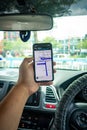 A man holding the iPhone X with Waze navigation app inside the car Royalty Free Stock Photo