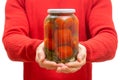 Man holding a jar of pickled tomatoes Royalty Free Stock Photo