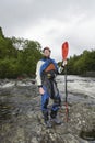 Man holding kayak oar by river Royalty Free Stock Photo