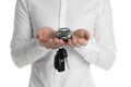 Man holding key and miniature automobile model on white background. Car buying Royalty Free Stock Photo