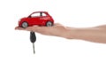 Man holding key and miniature automobile model on background, closeup. Car buying Royalty Free Stock Photo