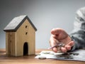 Man holding the key with model house. Saving money concept, real estate and property concept, Household savings and finances Royalty Free Stock Photo
