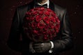 Man holding large bouquet of red roses. Valentines day gift with space for text