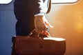 Man holding leather bag while on train. Royalty Free Stock Photo