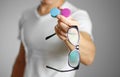 A man holding lenses for eye glasses. Close up. backgro Royalty Free Stock Photo