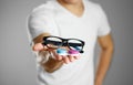 A man holding lenses for eye glasses. Close up. backgro Royalty Free Stock Photo