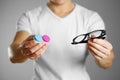 A man holding lenses for eye glasses. Close up. backgro Royalty Free Stock Photo