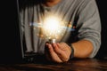 Man holding a light bulb Find new ideas and view. Royalty Free Stock Photo