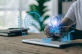 Man holding light bulb with windmill icon, energy source, global ecology concept, Royalty Free Stock Photo