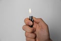 Man holding lighter on white background, closeup Royalty Free Stock Photo