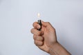 Man holding lighter on white background, closeup Royalty Free Stock Photo