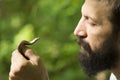 Man holding little snake Royalty Free Stock Photo