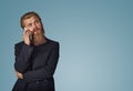 Man holding looking up talking speaking on phone thinking Royalty Free Stock Photo