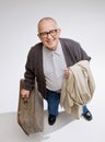 Man holding luggage and coat Royalty Free Stock Photo