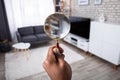 Man Holding Magnifying Glass