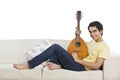 Man holding mandolin and smiling Royalty Free Stock Photo