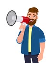 Man holding a megaphone/loudspeaker near to his mouth, shouting, announcing something. Man standing isolated in white background. Royalty Free Stock Photo