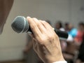 Man holding microphone in the hand, Speaker at conference Royalty Free Stock Photo