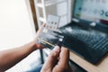 Man holding mock up credit card with number using smartphone and laptop computer for shopping.Online shopping concept Royalty Free Stock Photo