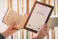 Man holding a modern ebook reader and book Royalty Free Stock Photo