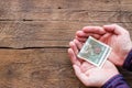 Man holding money on donations