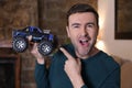 Man holding monster truck remote controlled toy vehicle Royalty Free Stock Photo