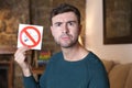 Man holding no smoking sign Royalty Free Stock Photo