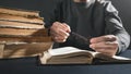 Man holding old key with a book Royalty Free Stock Photo