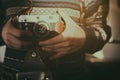 Man holding old retro camera in hands Royalty Free Stock Photo