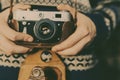 Man holding old retro camera in hands Royalty Free Stock Photo
