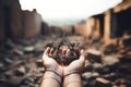 A man holding an old and rusty star of David in their hands on ruins background. Royalty Free Stock Photo