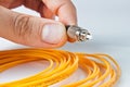 Man is holding a optical patchcord Royalty Free Stock Photo