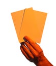 Man holding orange flyers on white background, closeup. Mockup for design Royalty Free Stock Photo