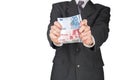 Man holding out euro banknotes