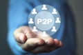 Man holding P2P word with people icon. Concept of peer to peer