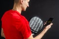 man holding paddel racket and smartphone. High quality photo Royalty Free Stock Photo