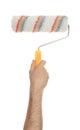 Man holding paint roller brush on white background, closeup Royalty Free Stock Photo