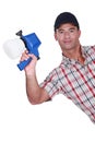 Man holding paint sprayer