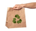 Man holding paper bag with recycling symbol on white background, closeup Royalty Free Stock Photo