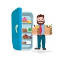 Man holding the paper bags full of fruits, vegetables and bakery products in front of a refrigerator Royalty Free Stock Photo