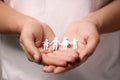 Man holding paper family figures, closeup. Insurance concept Royalty Free Stock Photo