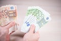 Man holding paper money - euros in the hand Royalty Free Stock Photo