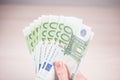 Man holding paper money - euros in the hand Royalty Free Stock Photo