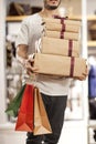 Man holding paper shopping bag with gift boxes Royalty Free Stock Photo