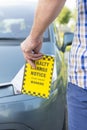 Man holding parking ticket Royalty Free Stock Photo