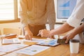 Man holding pen to point in paperwork, business meeting concept