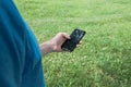 Man holding a phone in hand. Touching a screen Royalty Free Stock Photo