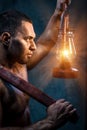 Man holding pickaxe and oil lamp Royalty Free Stock Photo